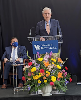 McConnell spoke at the University of Kentucky as Dr. Mark Newman, head of the hospital, listened.